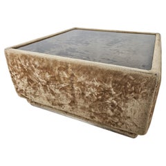 Fabric-covered 1970s coffee table with glass top