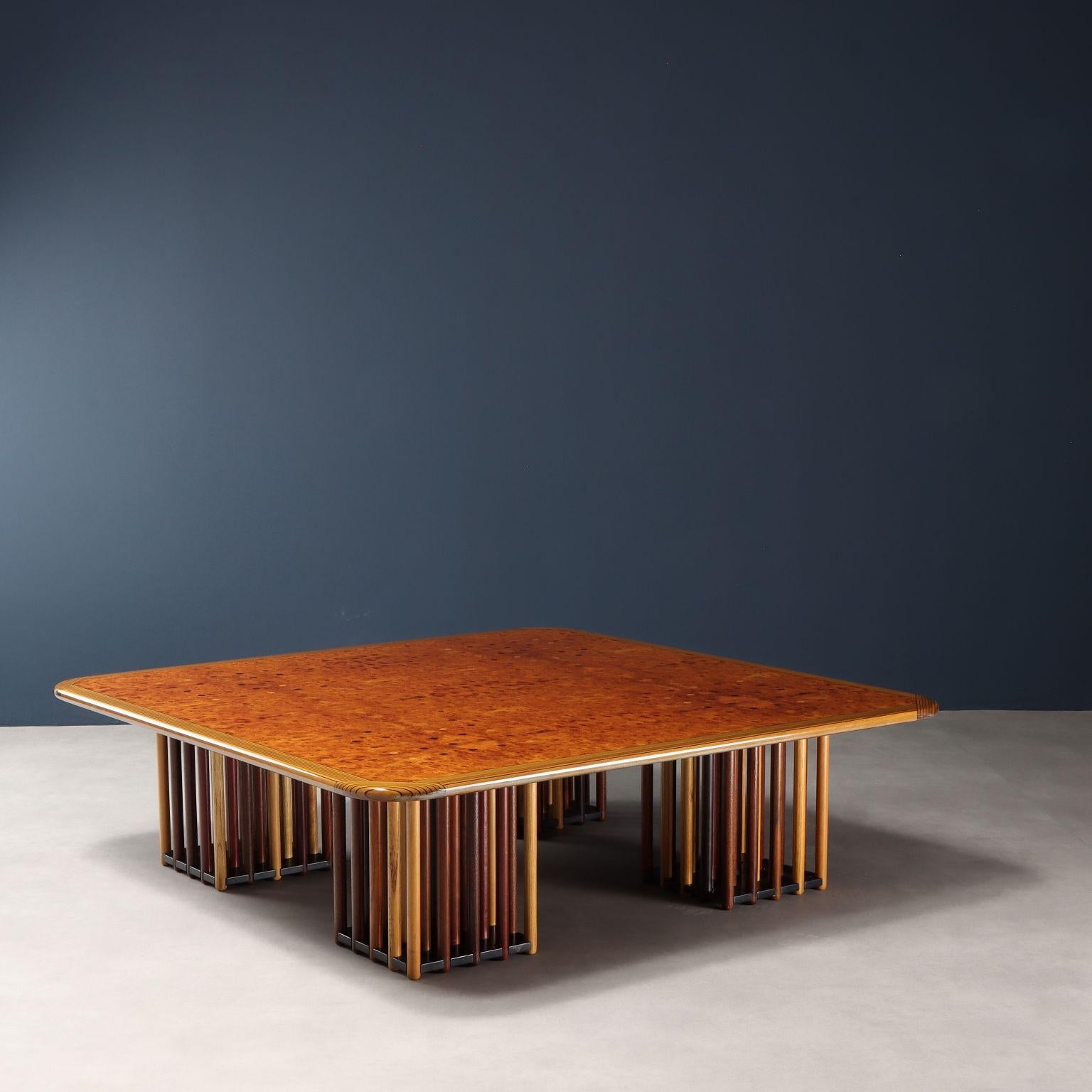 Center table from the 'Artona' series designed by Afra & Tobia Scarpa for a 1970s Maxalto production. Beveled square top with briar veneer, legs composed of cylindrical columns made of different woods. In good overall condition, shows light signs of