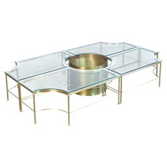 Low, modular Hollywood Regency-style coffee table with a plant stand. 1970s