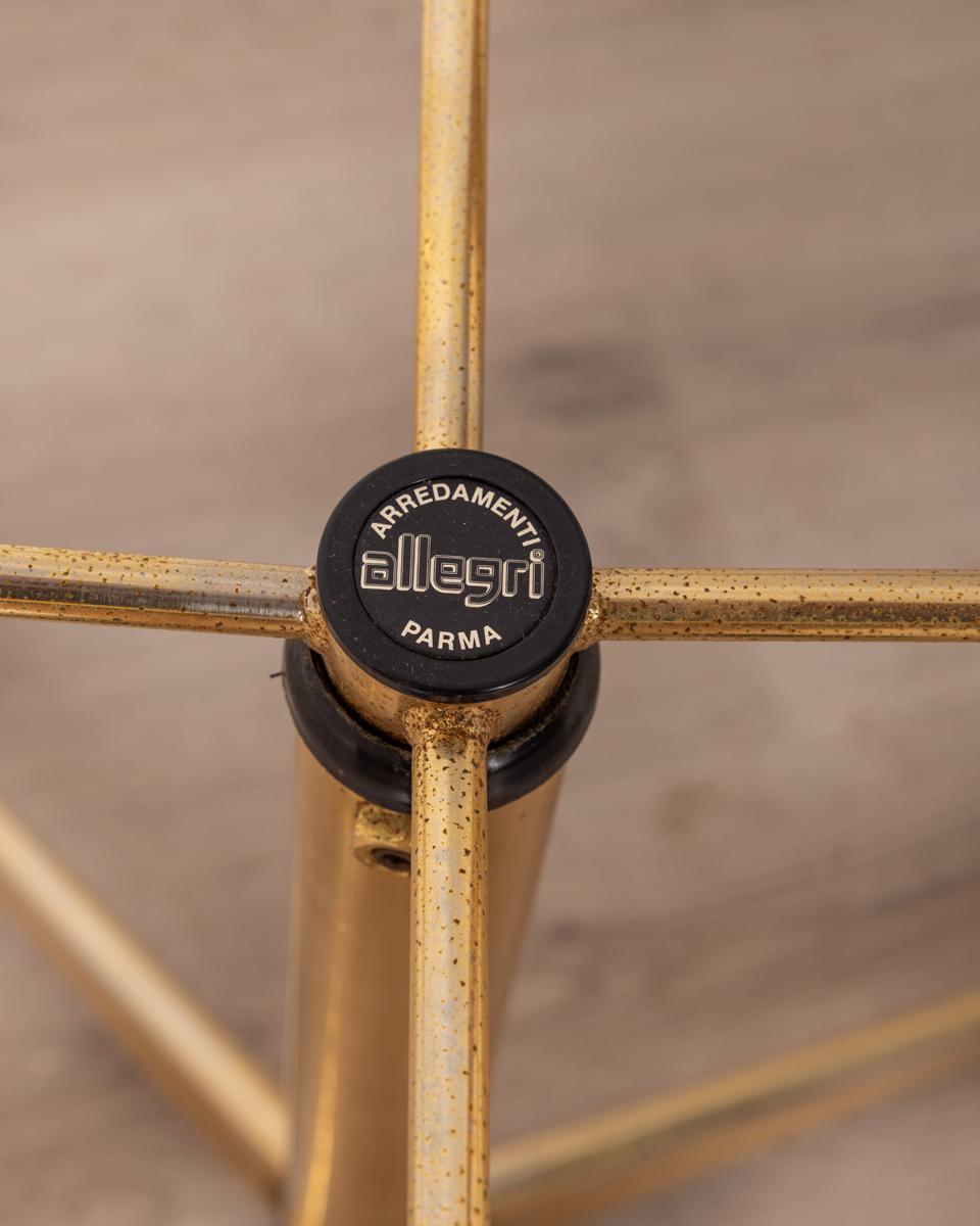 Small trolley table made of gilded metal and smoked glass top, adjustable height, design Allegri Parma, 1970s.

CONDITION: In good condition, shows signs of wear given by time.

DIMENSIONS: Height 60 cm; Width 40 cm; Length 55 cm

MATERIAL: Metal
