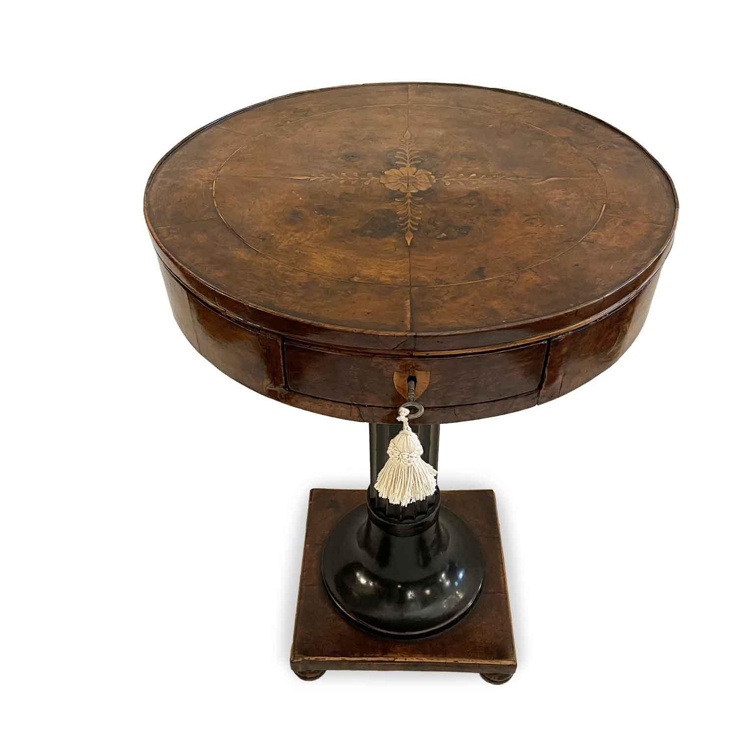 Empire Coffee Table Early 1800s Circular with Drawer on Square Base with a  turned central support in ebonized wood, a fluted column in the central part that connects to the circular top with the walnut-paneled band in which a drawer opens: at the
