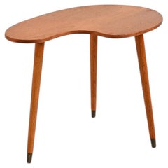 Tavolino con top dalla forma organica in teak e ottone, anni ’50-’60