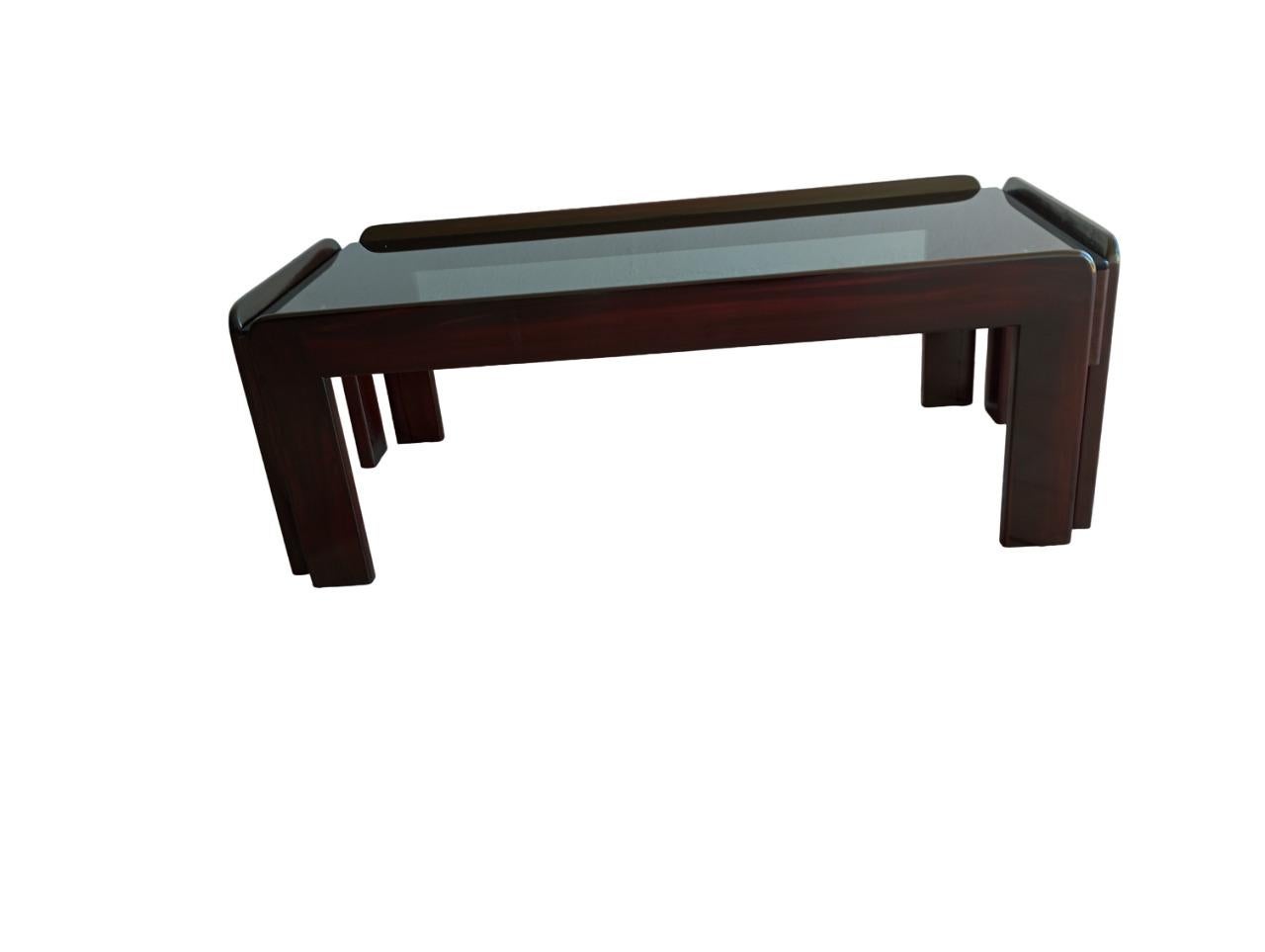 Coffee table designed by Afra (1937-2011) and Tobia (1935) Scarpa for Cassina dimensions  h 36 cm. x 102 cm. x 48.5 cm., a fine example of 1960s Italian design.
The smoked glass top, gives visual lightness and a sophisticated touch.
The frame is