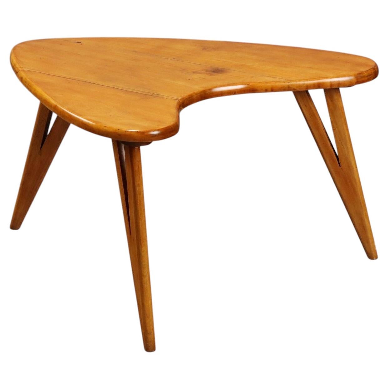 Coffee table from the 1950s–1960s, made of beech wood with a rounded shape.