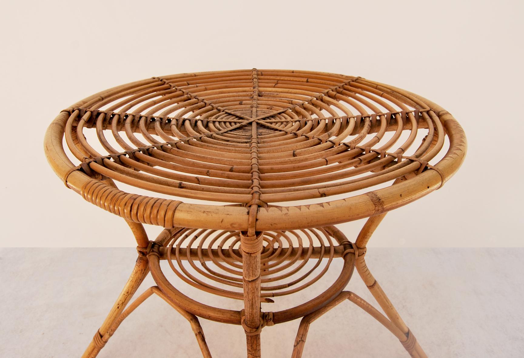 Wicker and bamboo round coffee table, 1960s. 
This item has a solid structure with shelf underneath. 
Condition is perfect, some slight signs of use due to time.  
The price of shipping is for the Italian territory, for the islands and for shipping