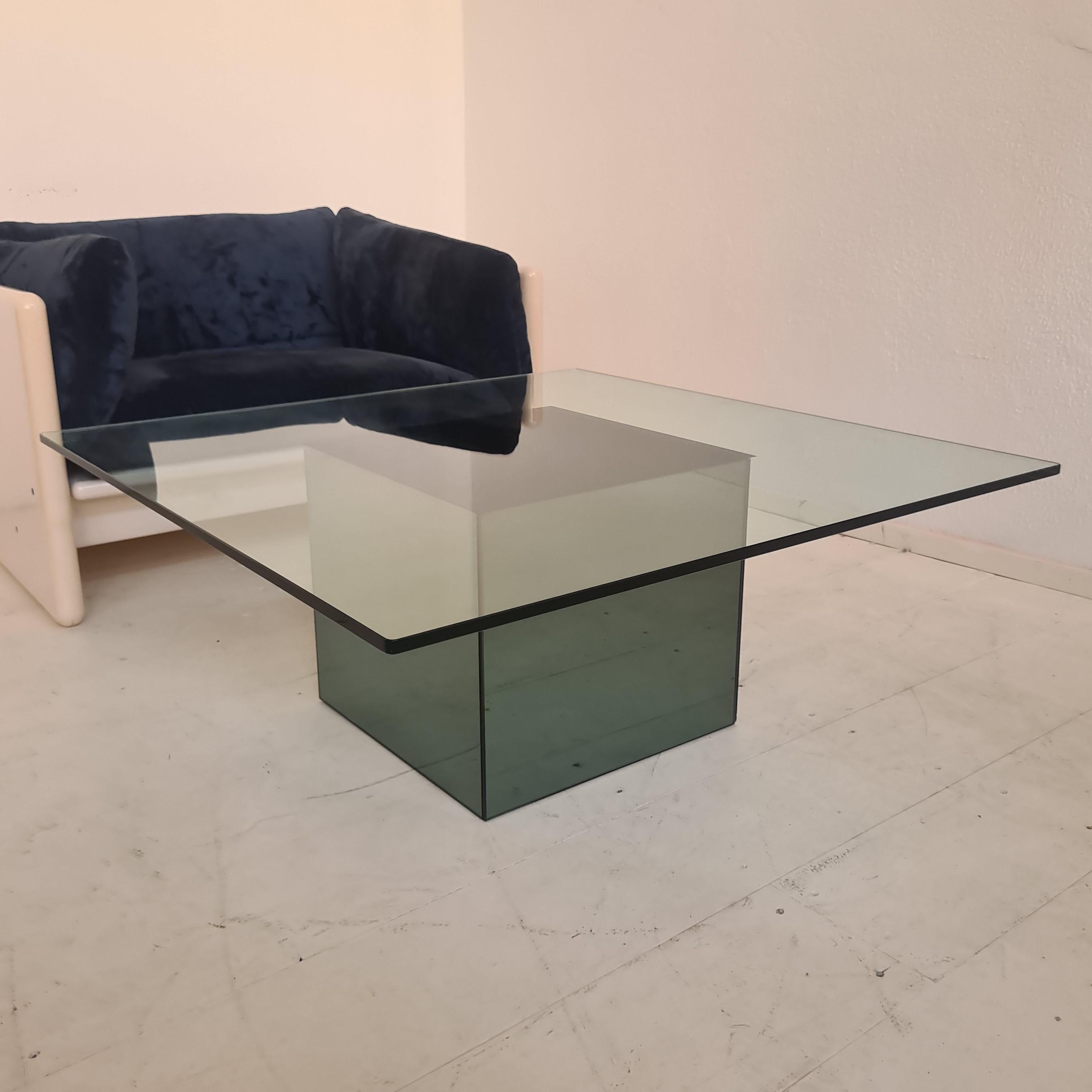 Iconic 1970s design coffee table with square glass top and mirror cube at base
Drawn  by Nanda Vigo in the early 1970s for the well-known company Acerbis 
excellent overall condition
only defect a small glass chip not visible at the base 
see last
