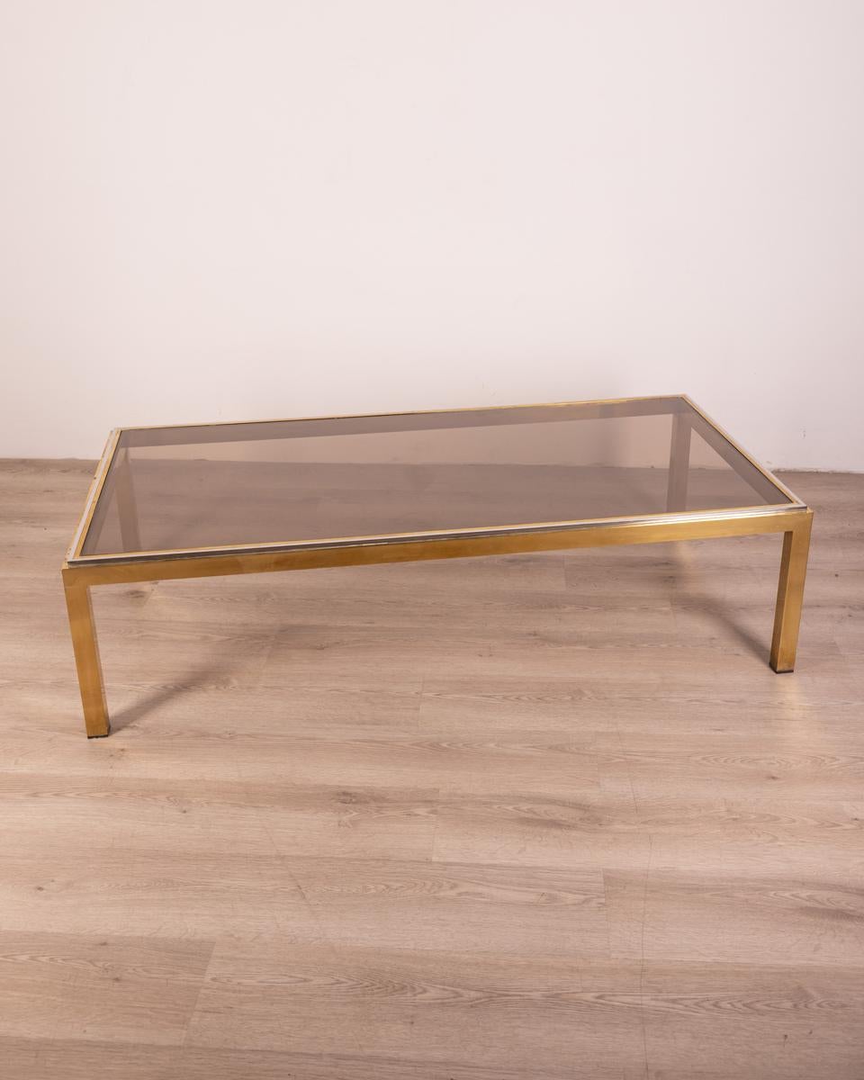 Large rectangular coffee table in gilt brass and chrome finishes, smoked glass, Italian design, 1960s.

CONDITION:
In good condition, shows signs of wear given by time.

SIZING:
Height 40 cm; width 150 cm; length 75 cm;