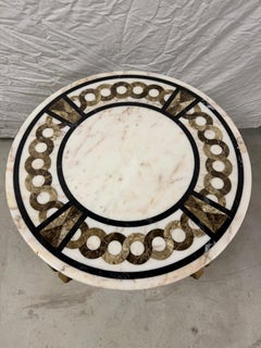 Tavolino in marmo circolare con base in ferro e bronzo XX secolo italian