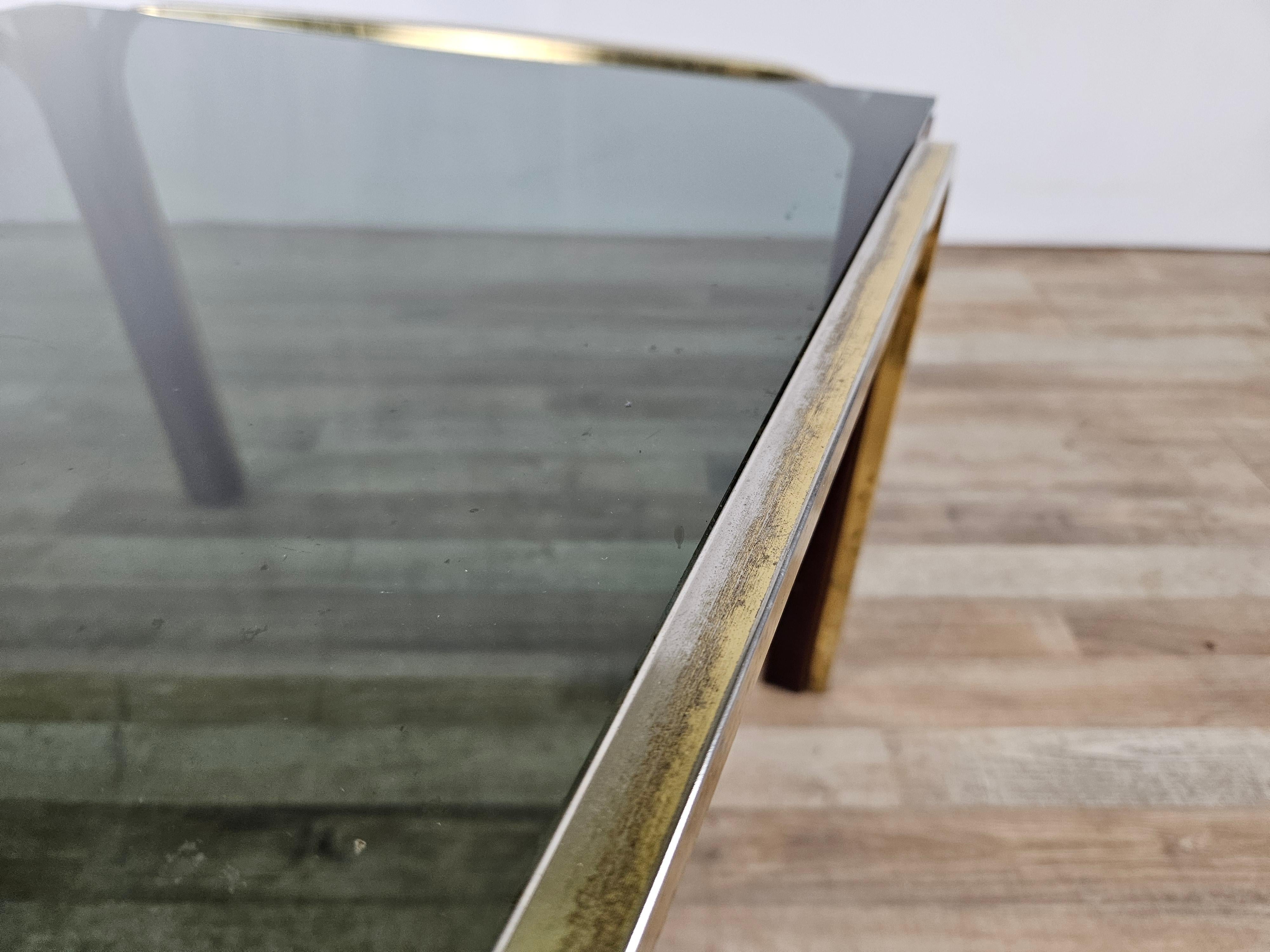 Metal Gold metal and smoked glass coffee table 1970s For Sale