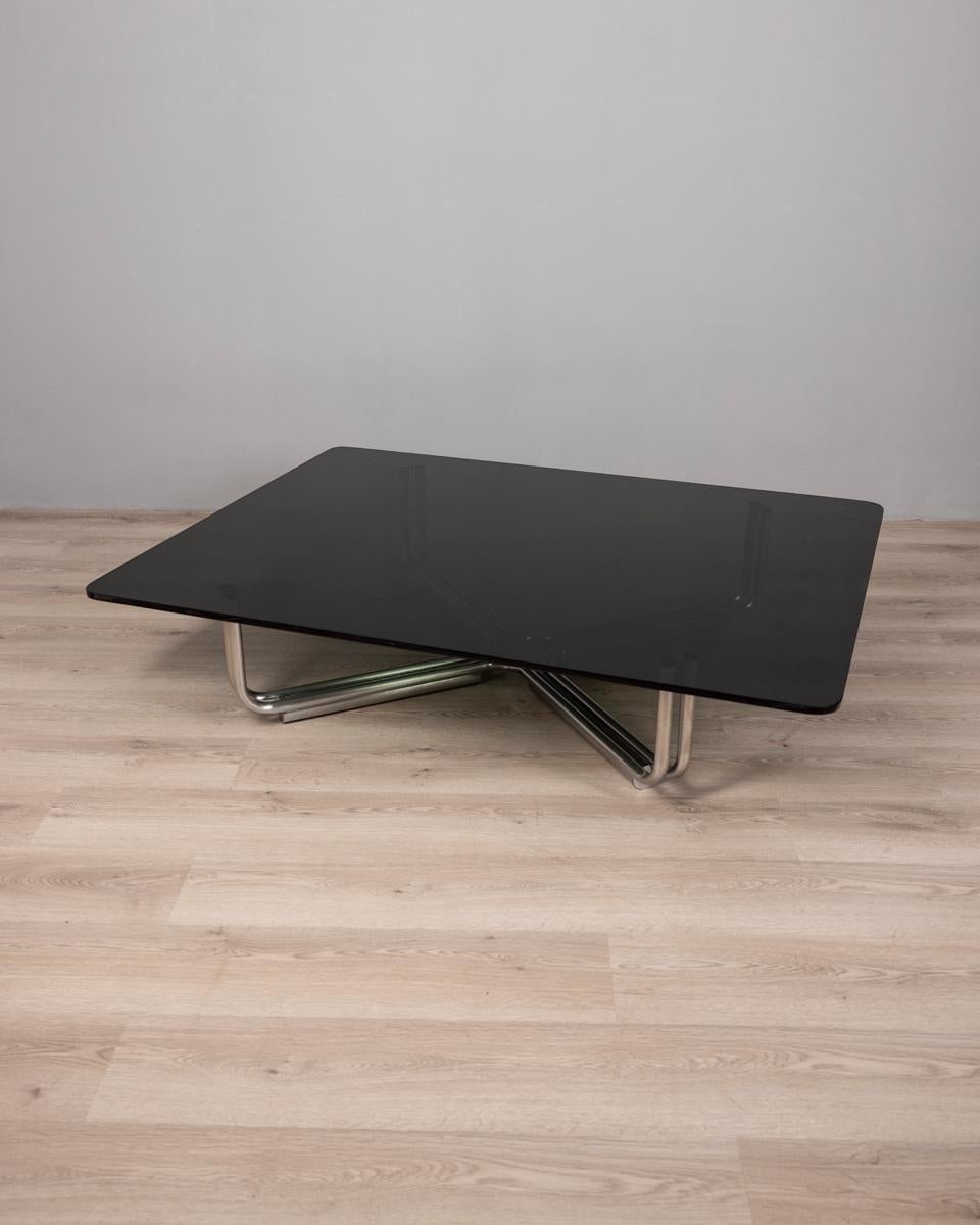 Large coffee table with chromed metal base and smoked glass top, model 784, design Gianfranco Frattini for Cassina, 1960s.

CONDITION:
In good condition, shows signs of wear and tear given by time

SIZING:
Height 30.5 cm; Width 130 cm; Length 130 cm