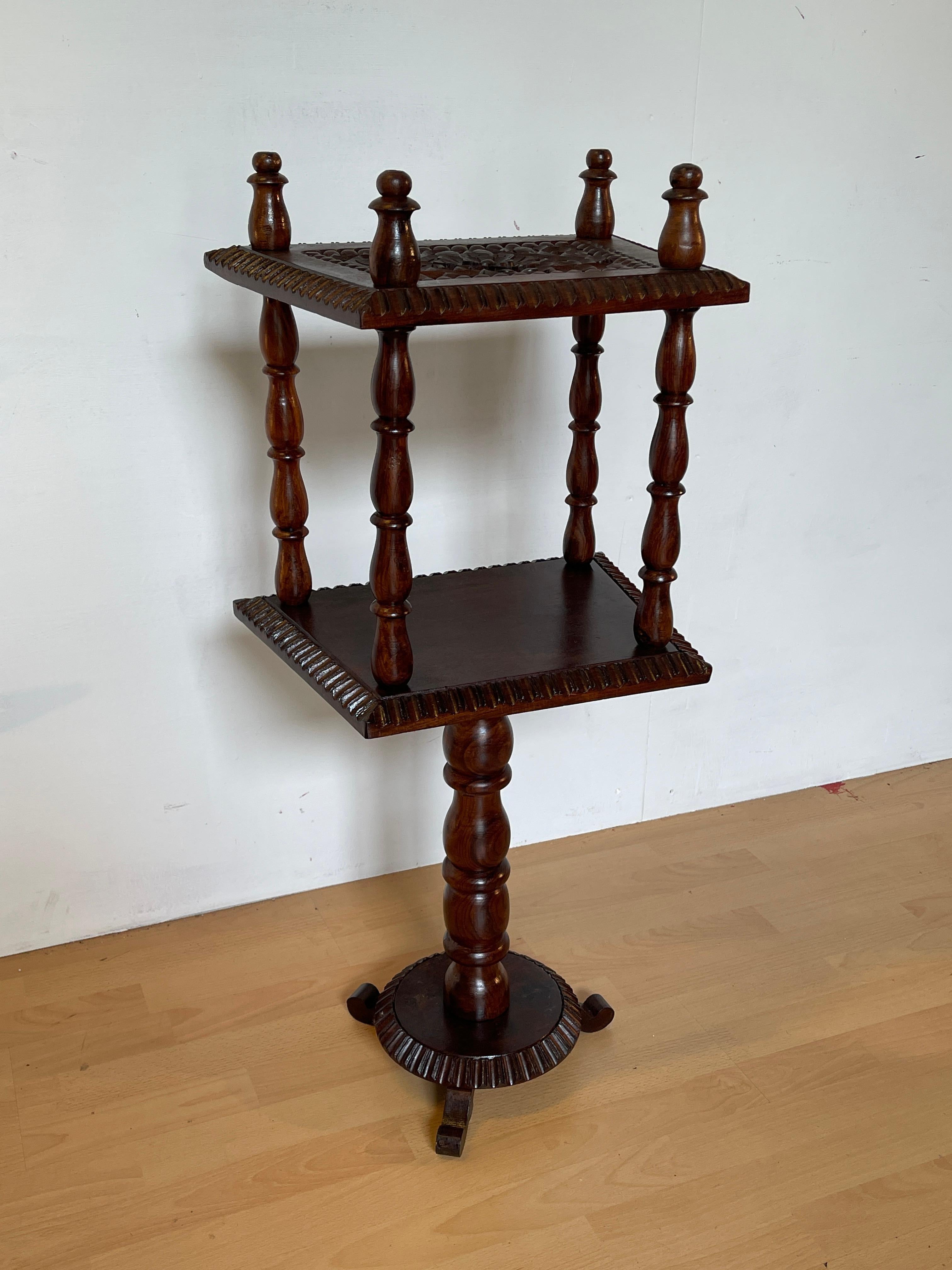 Elegance and craftsmanship meet in this fine carved solid wood coffee table. The solid and stable three-foot base is embellished with detailed turning and carving, with carved posts that recall the tradition of classical design. The top shelf,