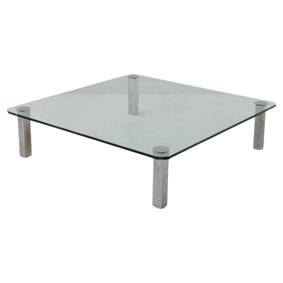 Vintage Italian glass coffee table with metal feet For Sale