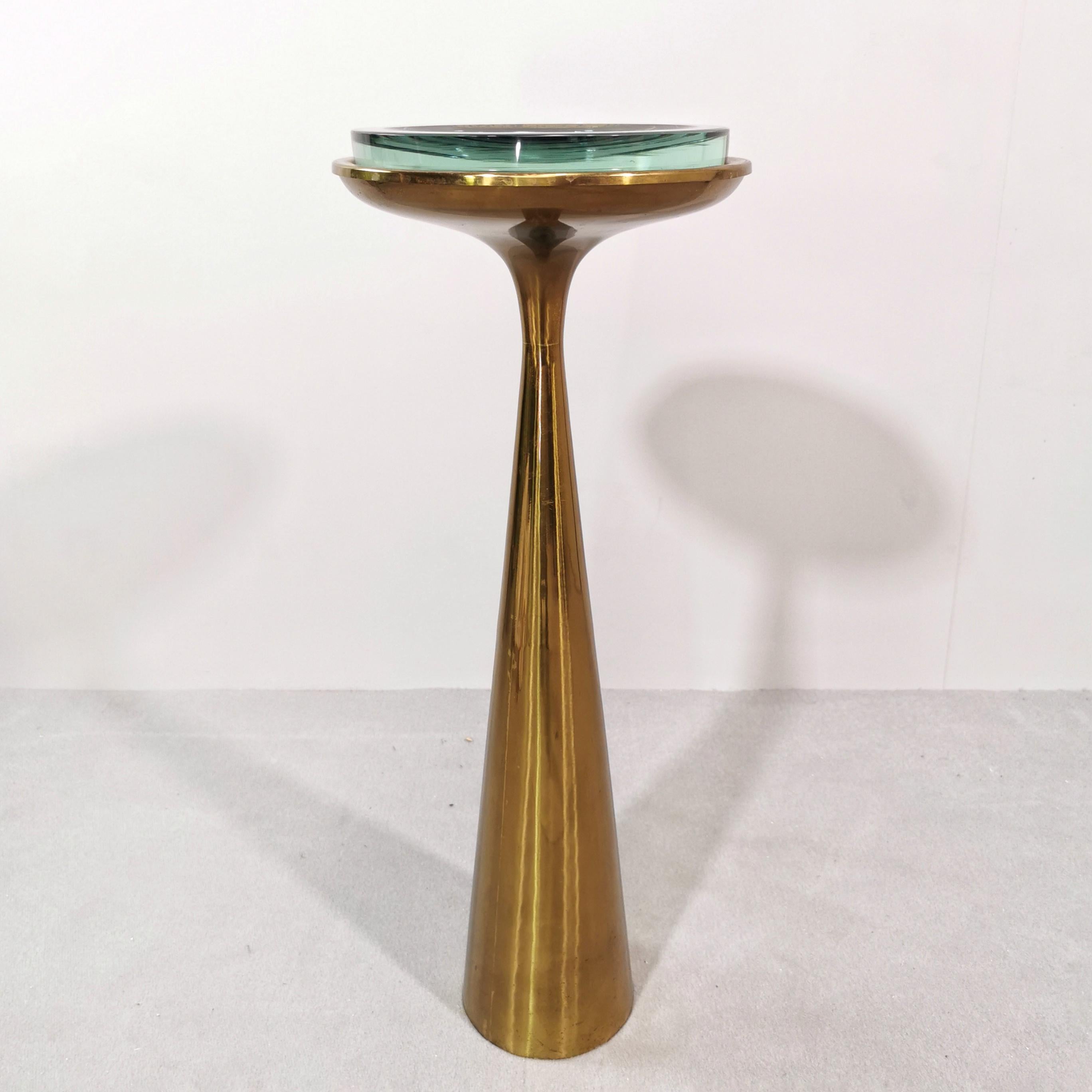 Rare Ashtray Table mod.1176 designed by Max Ingrand for Fontana Arte in the 1960s.
The conical brass structure about 65 cm high is in very good condition with no special marks 
fontanaarte glass plate is in perfect condition
The mark is shown under