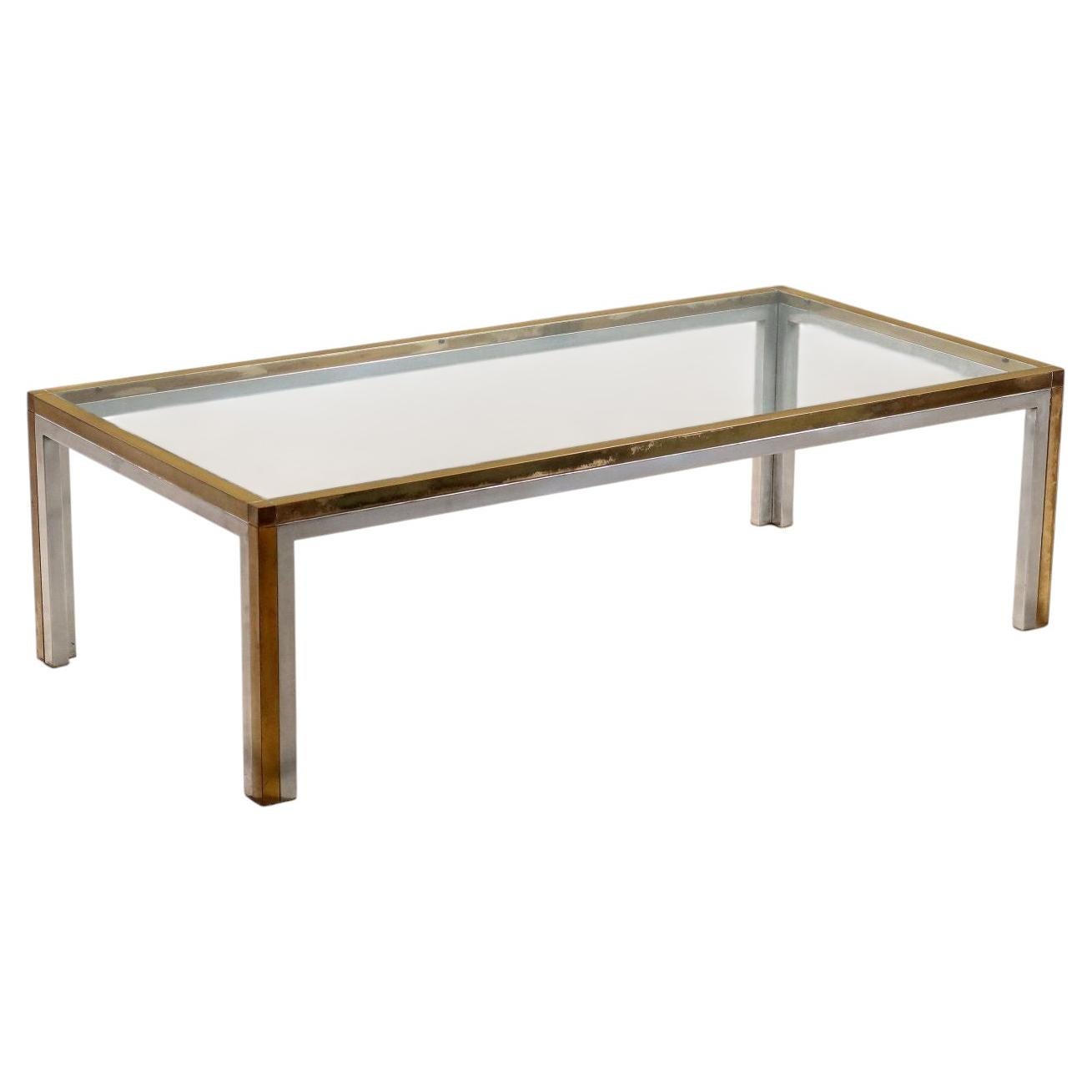 Rectangular coffee table from the mid-1970s, made of chrome-plated metal, brass, and a glass top