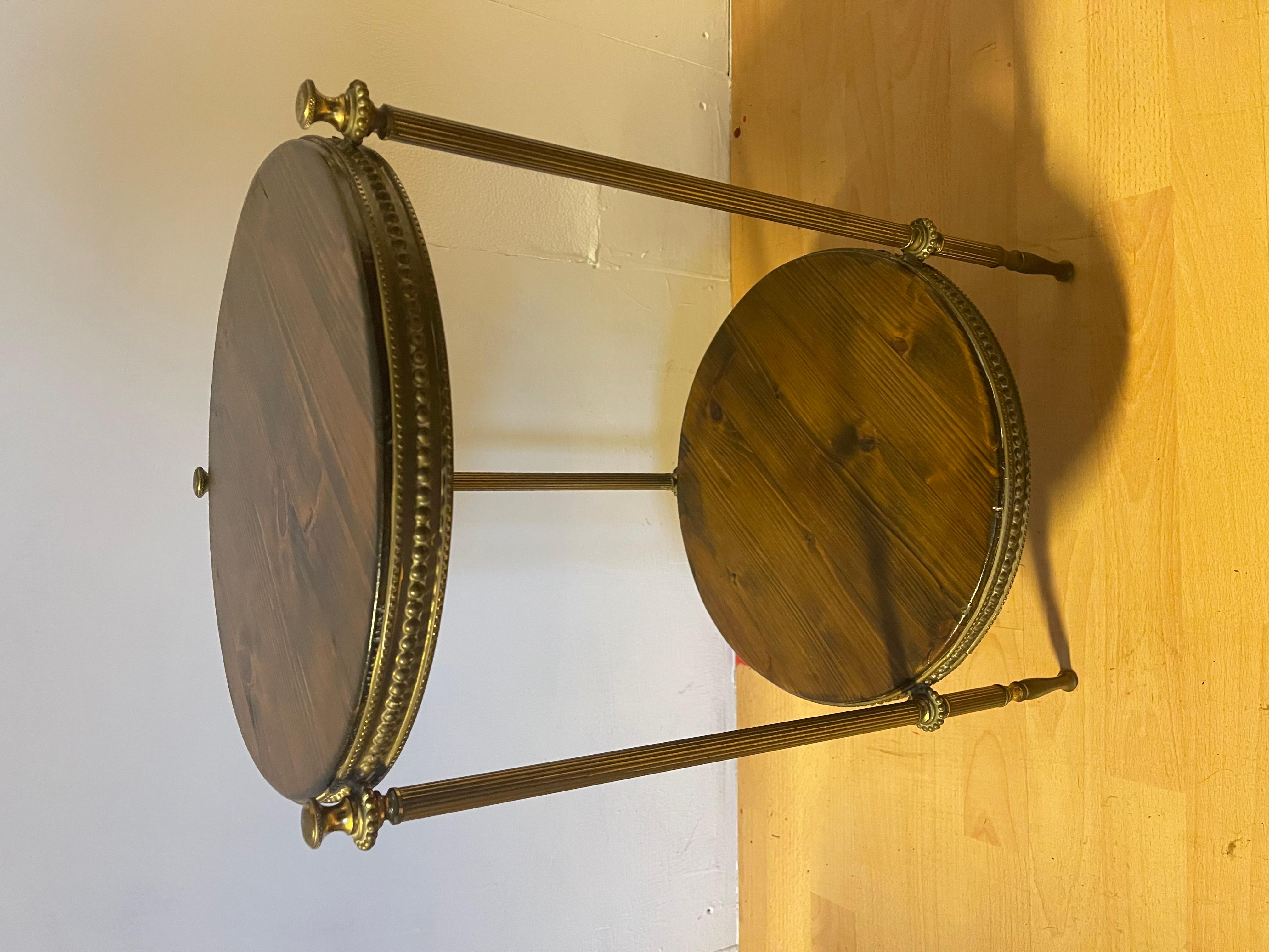 Two-shelf round brass and wood coffee table