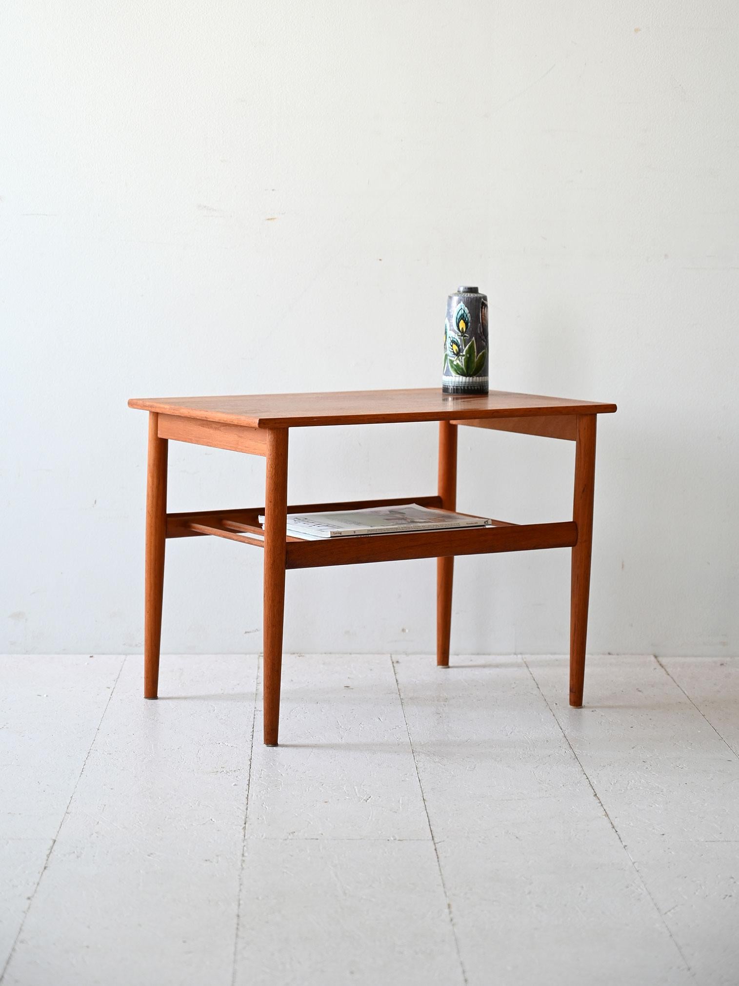 Scandinavian teak coffee table with lower shelf, designed by Yngvar Sundström for AB Seffle Möbelfabrik, Sweden, in the late 1950s and early 1960s.

This Scandinavian coffee table, made in the late 1950s and early 1960s by AB Seffle Möbelfabrik,