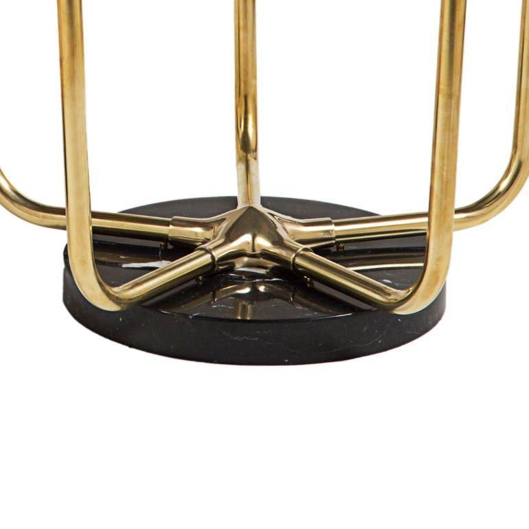 Introduce a touch of elegance to your space with our exquisite table featuring a sturdy brass frame and a luxurious black Marquinia marble top. The brass frame provides durability and a touch of timeless appeal, while the black Marquinia marble