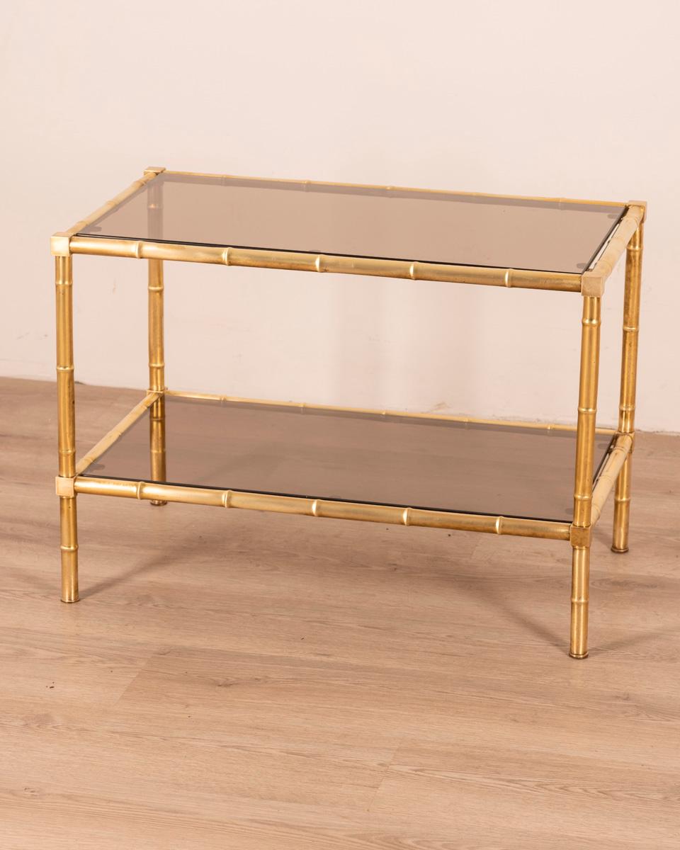 Coffee table with bamboo-shaped gilt brass frame and double smoked glass shelf, Italian design, 1960s.

CONDITION: In good condition, may show signs of wear given by time.

DIMENSIONS: Height 50.5 cm; width 70.5 cm; length 40 cm;

MATERIALS: Brass