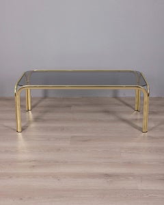 Vintage 70s coffee table in gilt brass and smoked glass Italian design