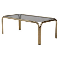 Vintage 70s coffee table in gilt brass and smoked glass Italian design