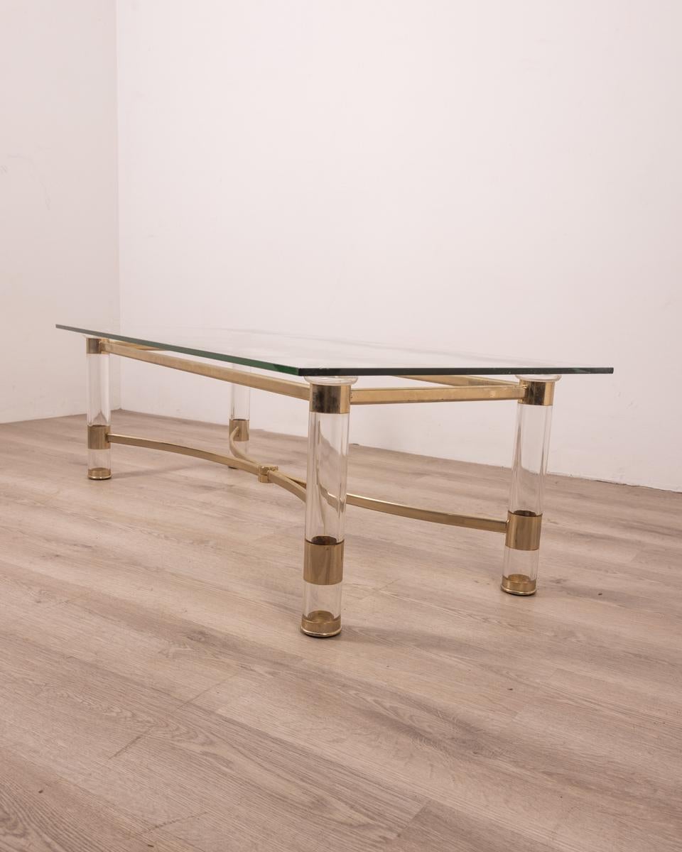 Lucite and brass frame coffee table with glass top. Design Sandro Petti for Metalarte, 1970s.

CONDITION: In good condition, may show signs of wear and tear given by time, glass has a central scratch visible in photo.

DIMENSIONS: Height 41 cm;
