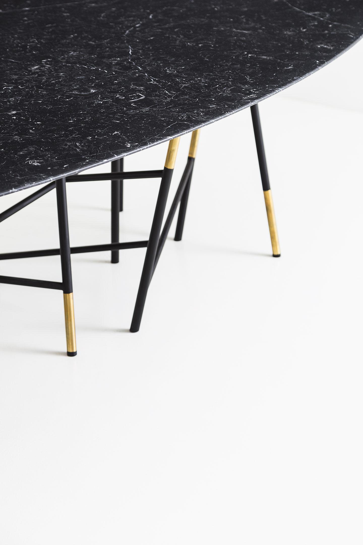 Tavolo 063 Table in Painted Metal and Brass with Marble Top
Elliptical table with structure in matte black painted metal and polished brass inserts. Black Marquina marble top with tapered edge.
Progetto Non Finito collection.