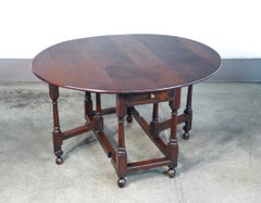 Solid oak band table with drawer. Nineteenth Century