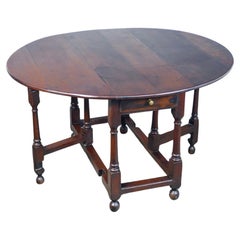 Solid oak band table with drawer. Nineteenth Century