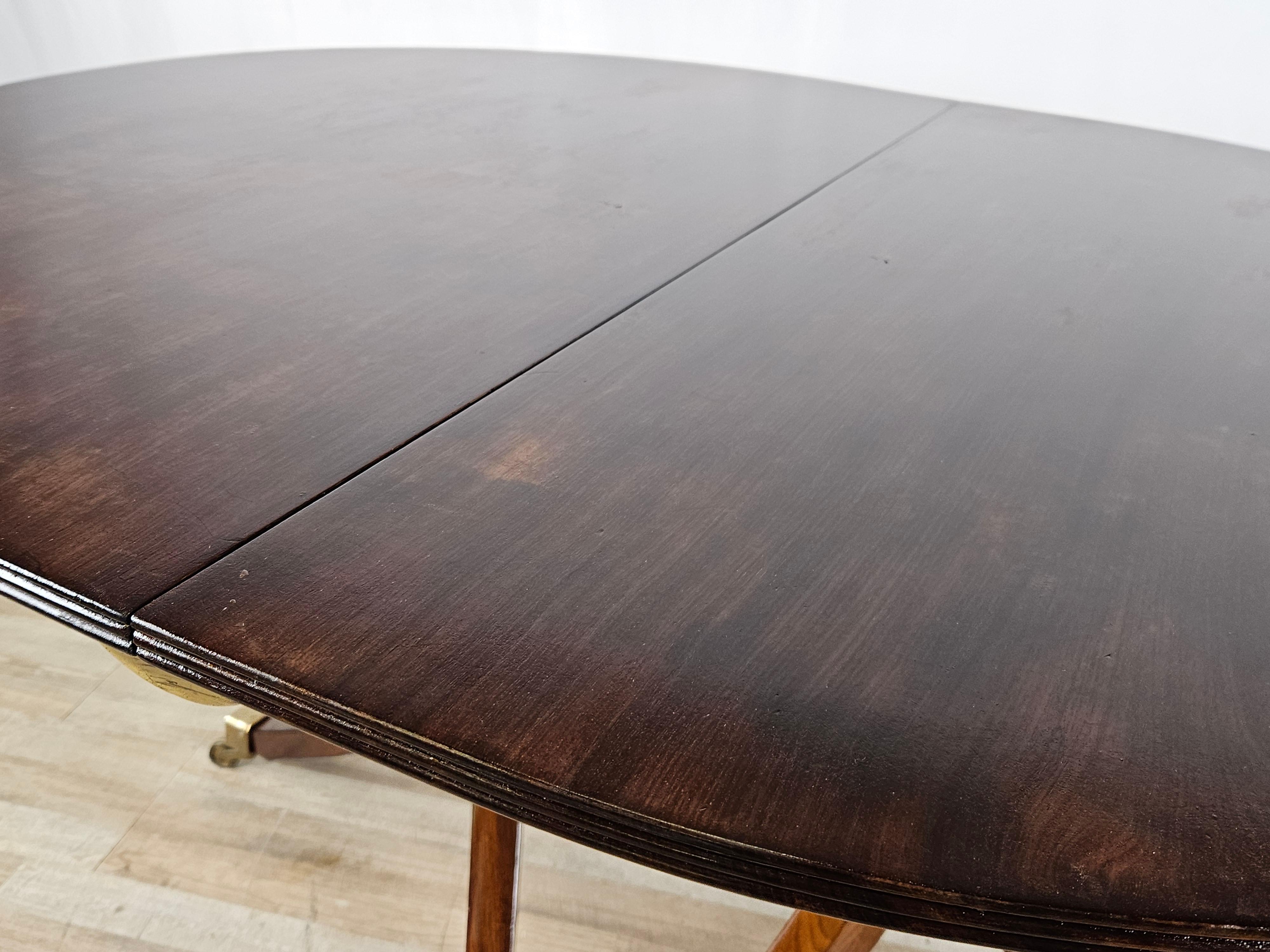 Brass English mahogany extending table 20th century For Sale