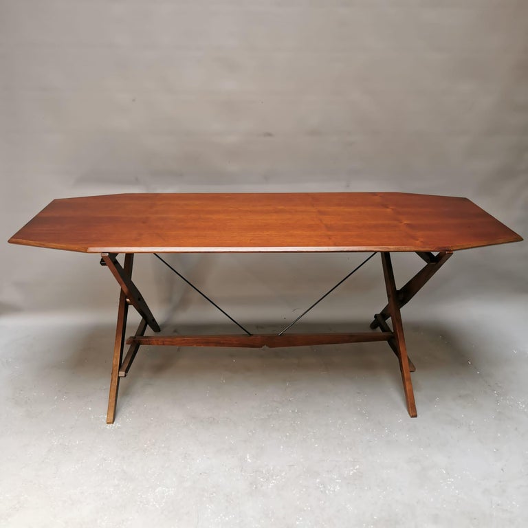 Remarkable project in the history of Italian design, Rosewood table, steel pulls, removable, produced by Poggi. The table has been restored.