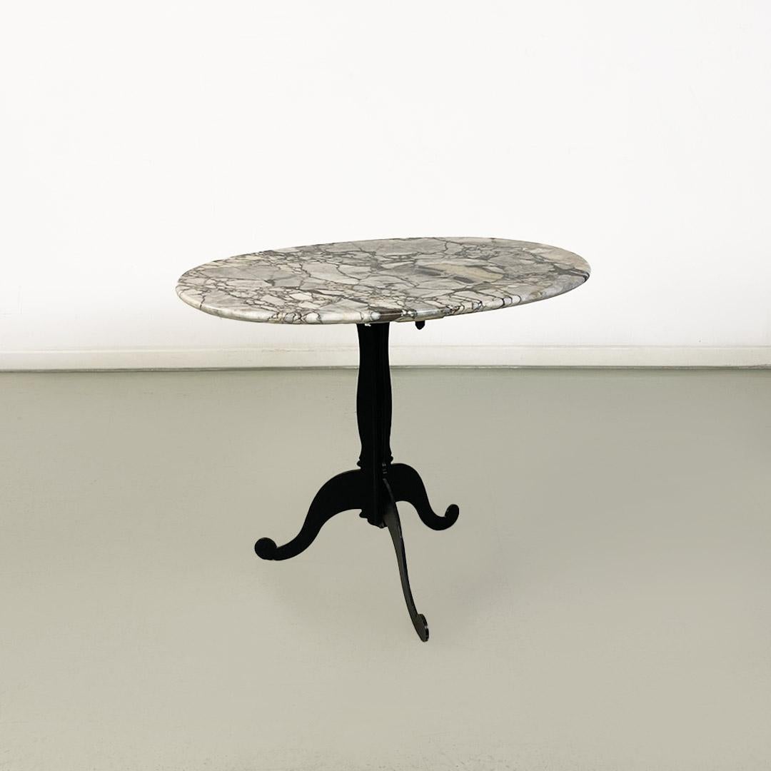 Modern Italian coffee table, with oval marble top and metal legs, ca. 1970. For Sale