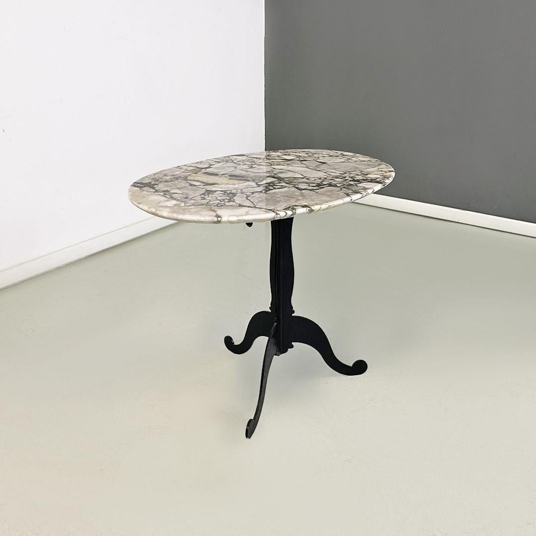 Metal Italian coffee table, with oval marble top and metal legs, ca. 1970. For Sale
