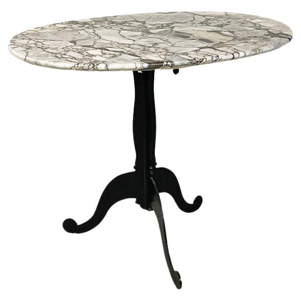 Italian coffee table, with oval marble top and metal legs, ca. 1970. For Sale