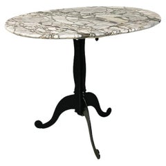 Italian coffee table, with oval marble top and metal legs, ca. 1970.