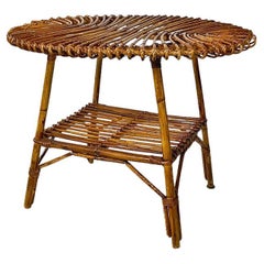Oval outdoor rattan coffee table, mid-century Italian, ca. 1960.