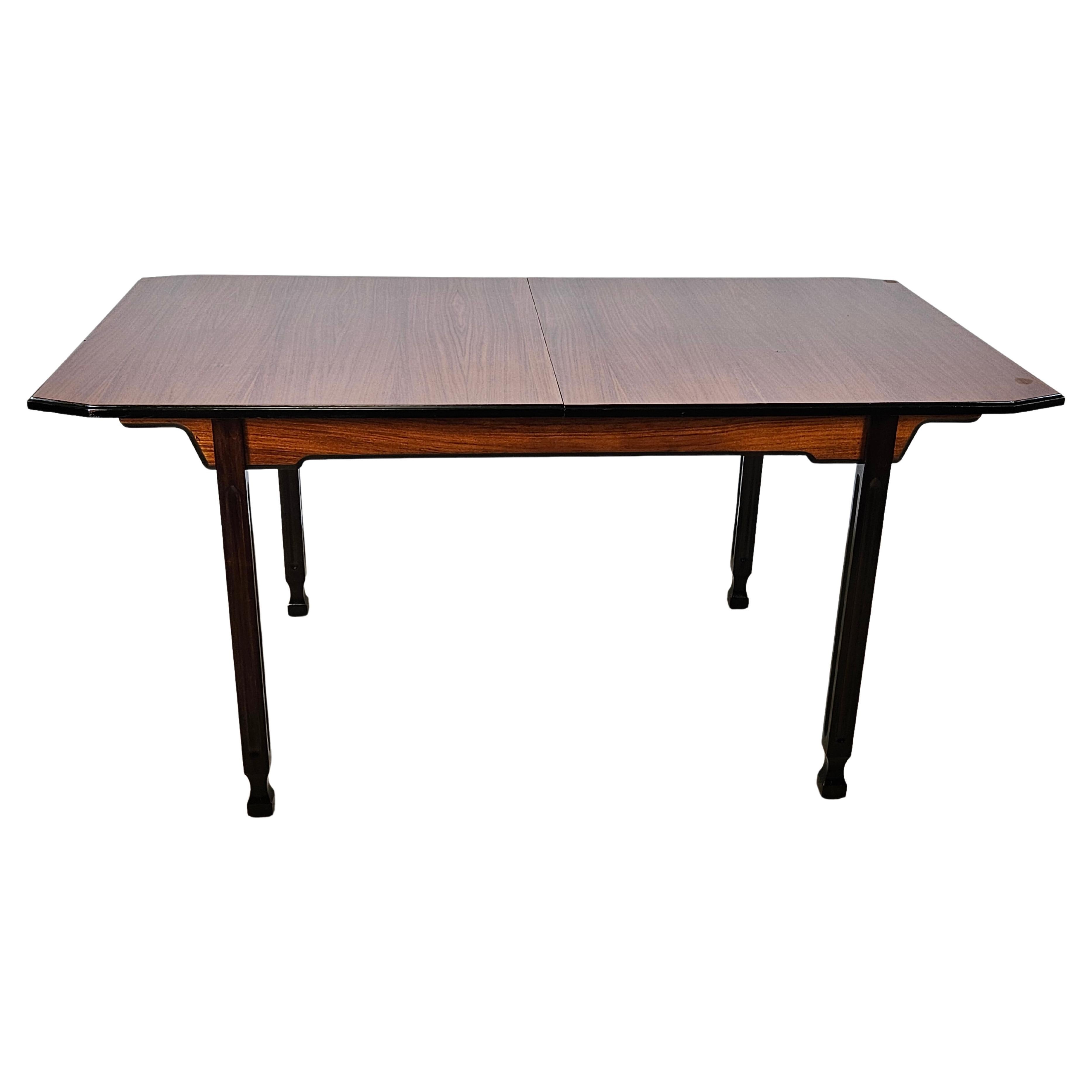 Scandinavian style extending dining table in walnut and ebony For Sale