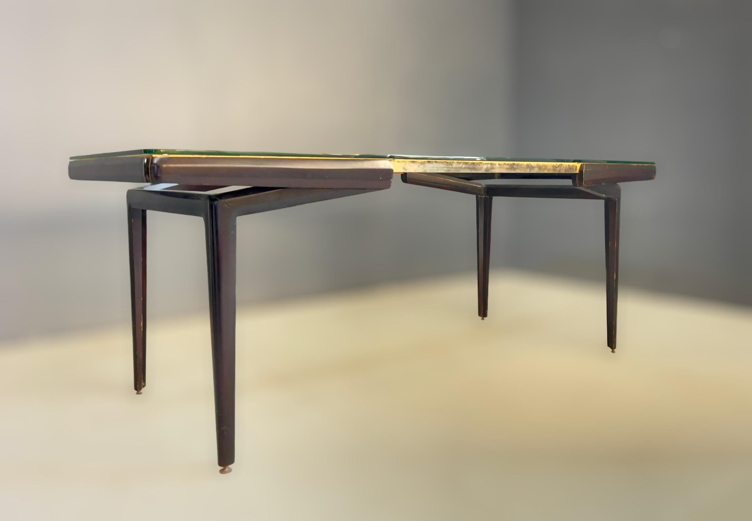 Beautiful dining table with wood and brass frame and glass top attributed to Giovanni Ferrabini. Italian manufacture. 1950s