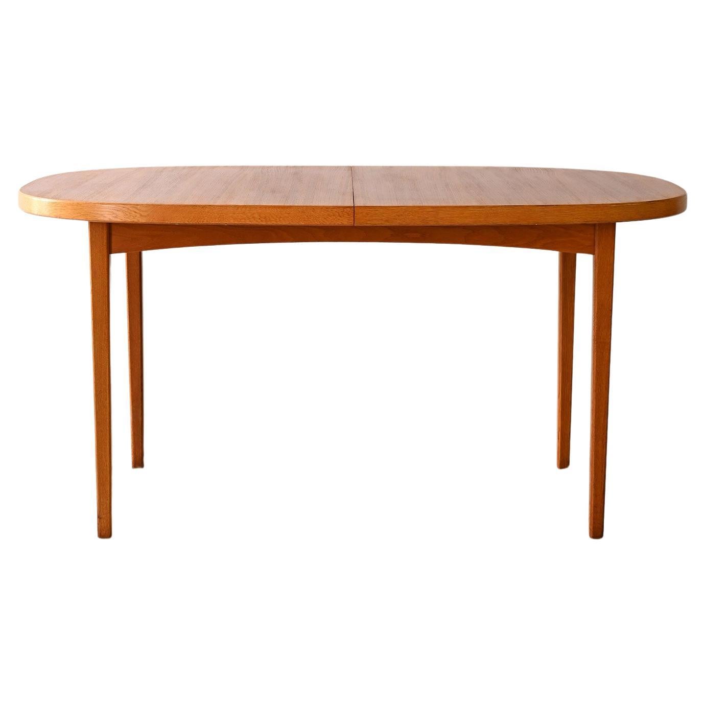 Teak dining table with round corners For Sale