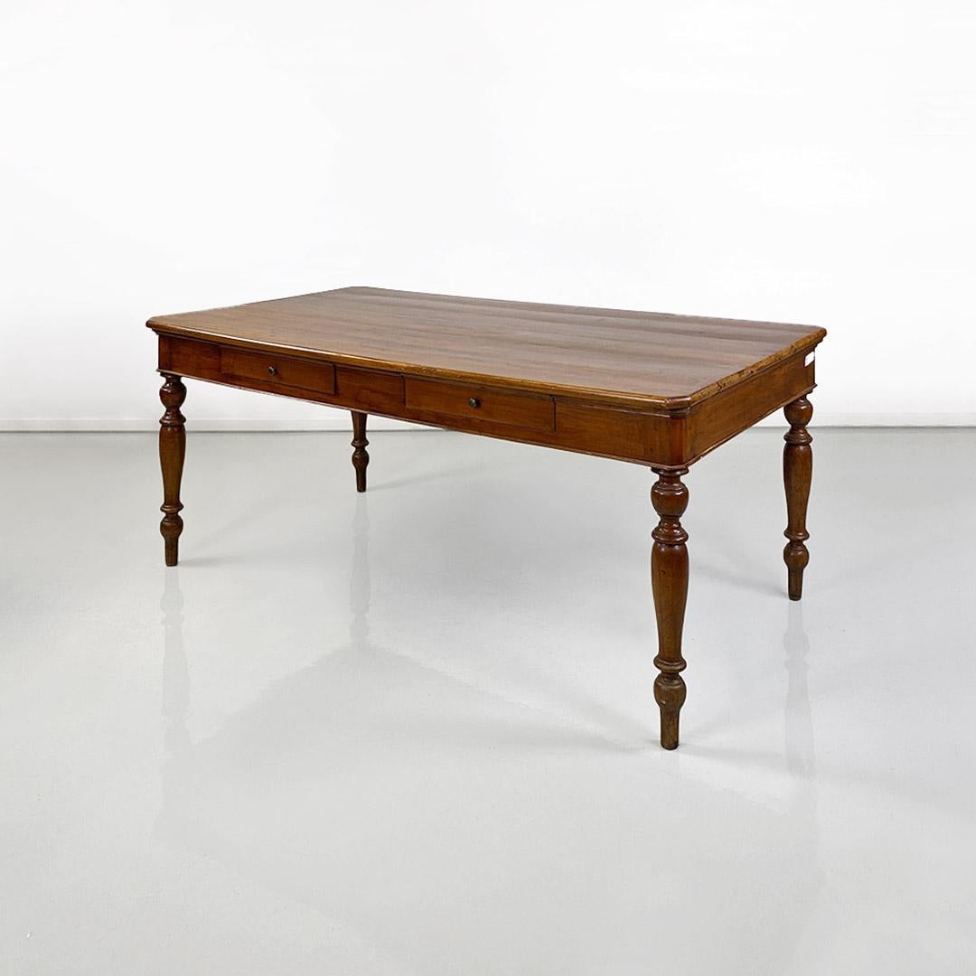Romantic Italian dining table, antique, solid walnut with two drawers, c. 1900. For Sale