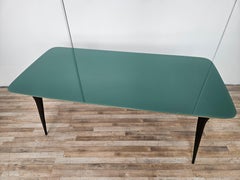 Mid century mahogany dining table with teal glass top