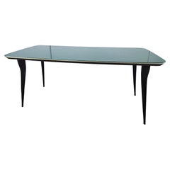 Mid century mahogany dining table with teal glass top