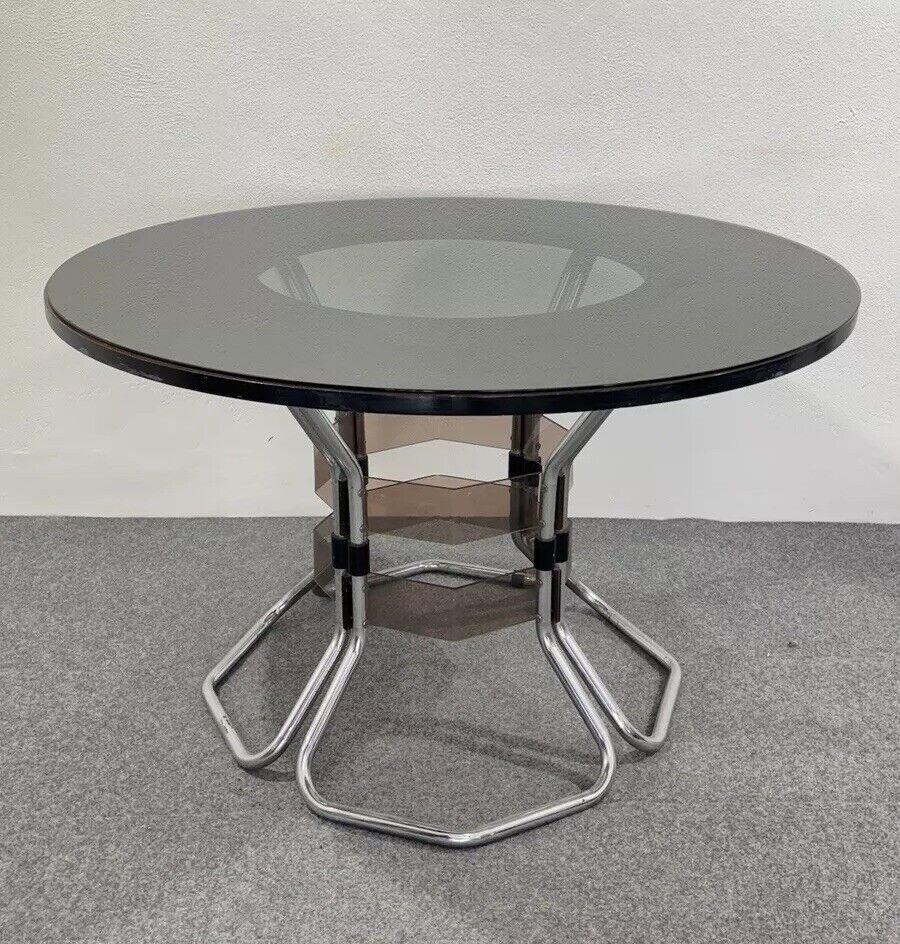 Dining Table Multi Material Design Modern Antiques 1970s.

Tubular chrome steel frame, acrylic details, wooden base and smoked glass top.

The item is in good conservative condition, no major cosmetic or structural defects to report, just slight and