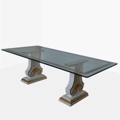 Dining table with a decorated glass top and lacquered and gold-finished wooden legs