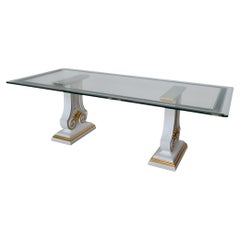 Dining table with a decorated glass top and lacquered and gold-finished wooden legs