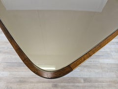 Rectangular walnut dining table with glass top and brass decorations