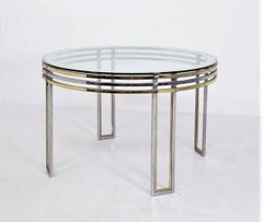 Romeo Rega's round dining table of brass, steel and decorated glass, 70s