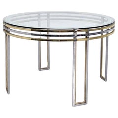 Mesa de comedor redonda de Romeo Rega en latón, acero y cristal decorado, años 70