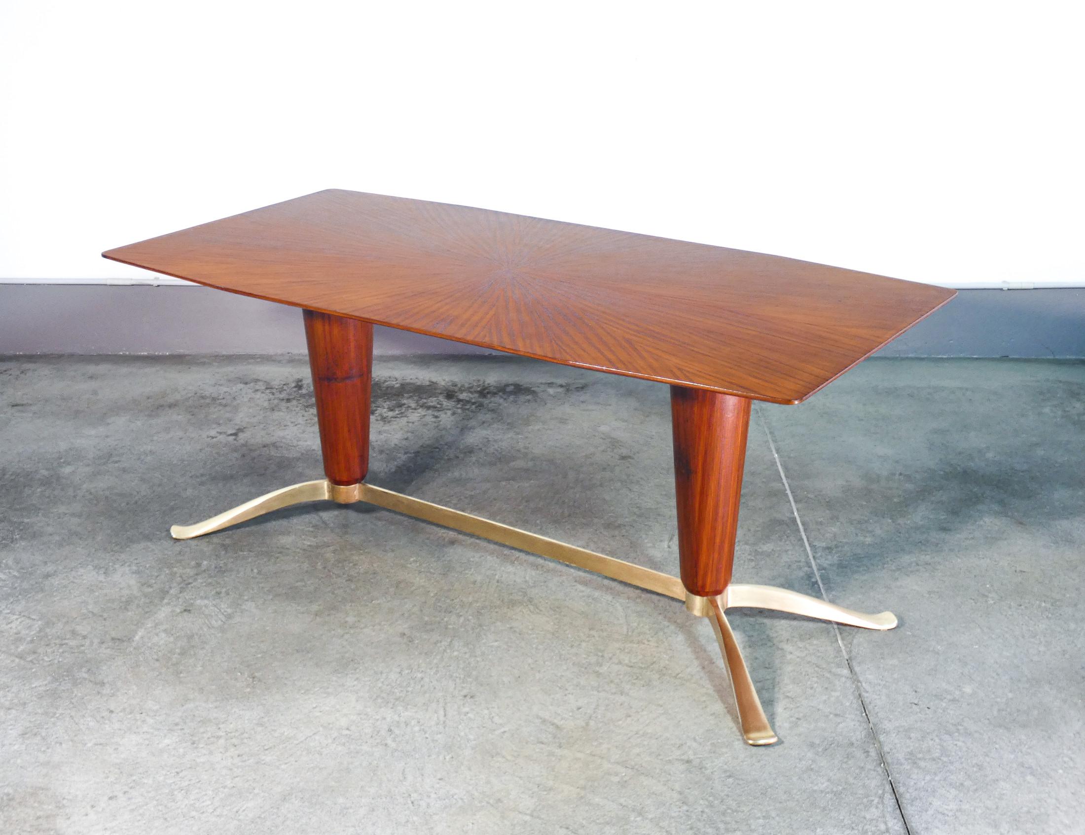 Designer Table
italian 1940s
attributed to the hand
by Paul BUFFA.

ORIGIN
Italy

PERIOD
1940s

DESIGNER
Attributed to Paul BUFFA

MATERIALS
Wood and brass

DIMENSIONS
Height:- 76cm
Width: 180cm
Depth: 90 cm

CONDITIONS
The table is in excellent