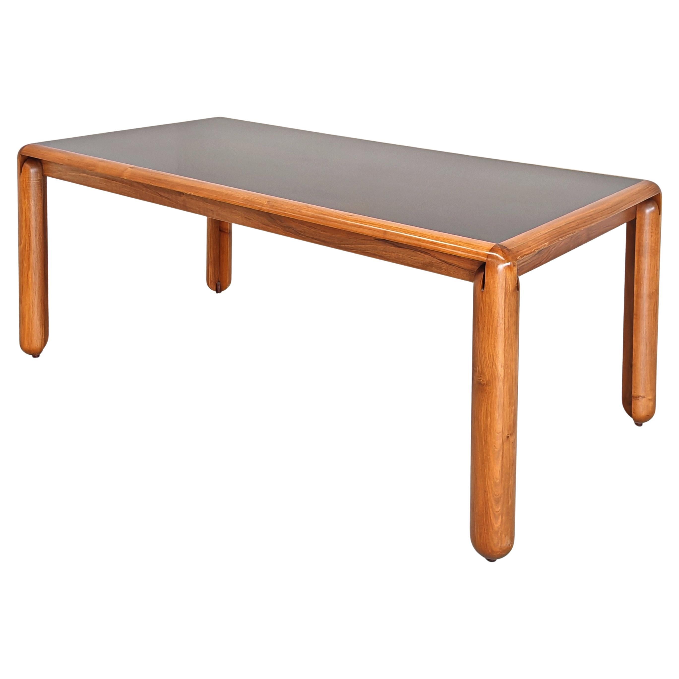 Elegant dining table model 781 by Vico Magistretti for Cassina with light walnut wood essence frame and top with ebonized effect. 
unique design especially in the format of the table legs and the connecting detail between the table and the leg