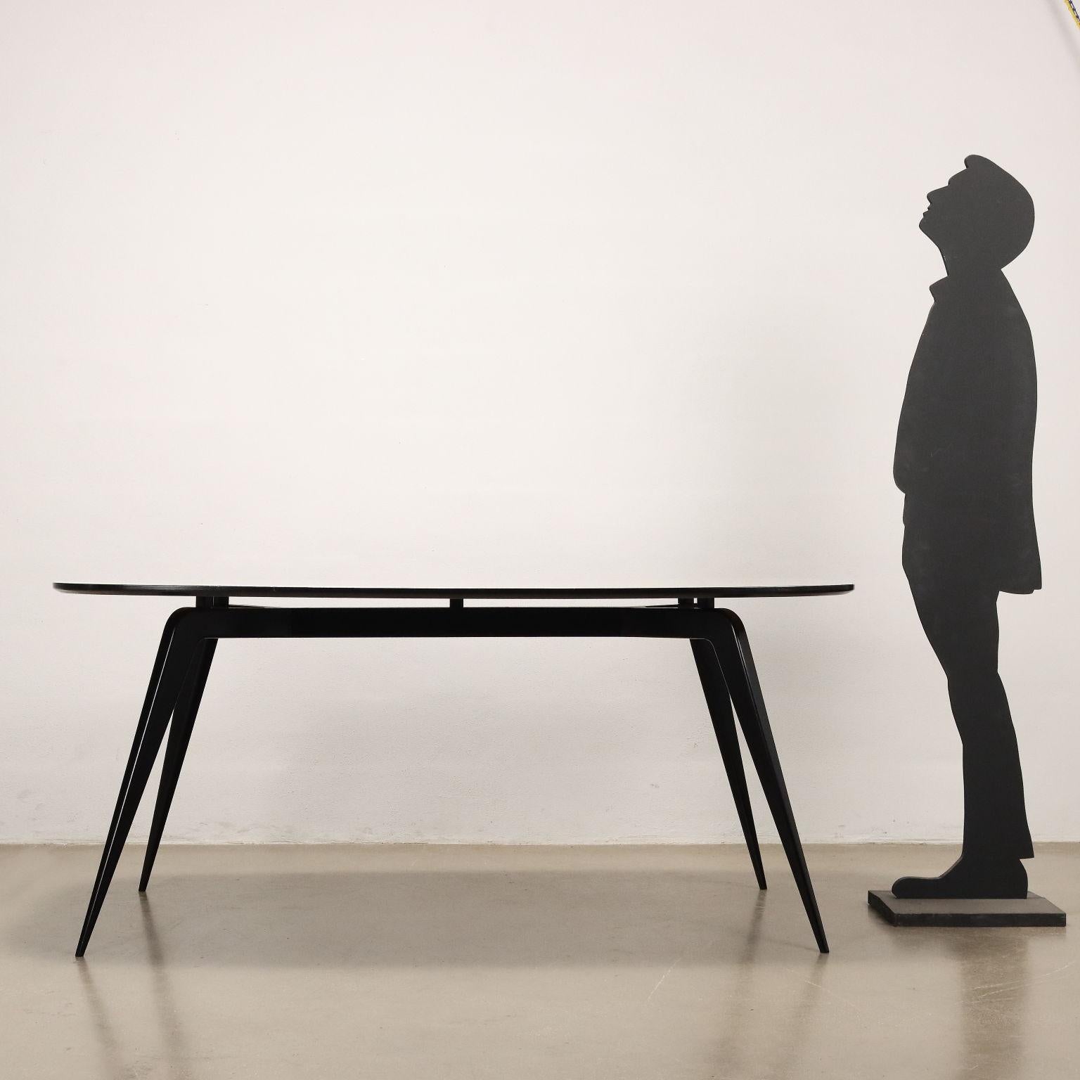 Elegant table with ebonized wood base, wooden top with back-treated glass. Restaurato.